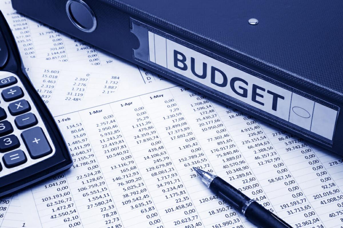 Binder with Budget, papers and calculator